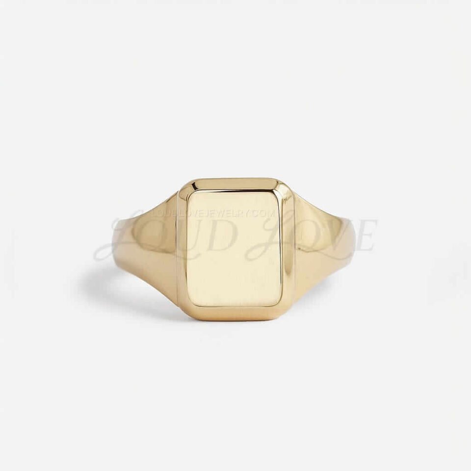 Antique-inspired signet ring with wide-to-narrow band and rectangular frame.