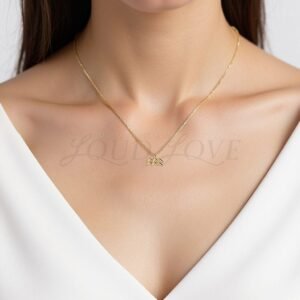 Fluid Aquarius symbol pendant worn to reflect originality and free-spirited style.