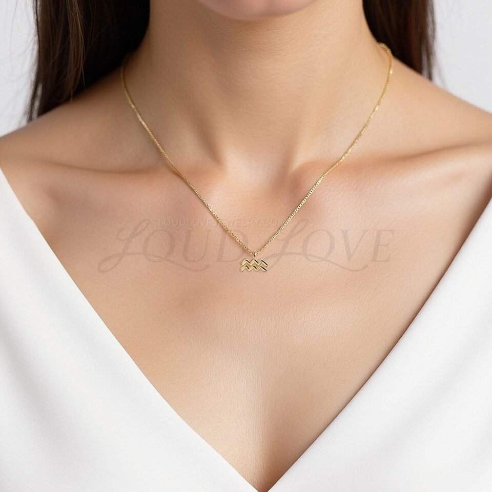 Fluid Aquarius symbol pendant worn to reflect originality and free-spirited style.