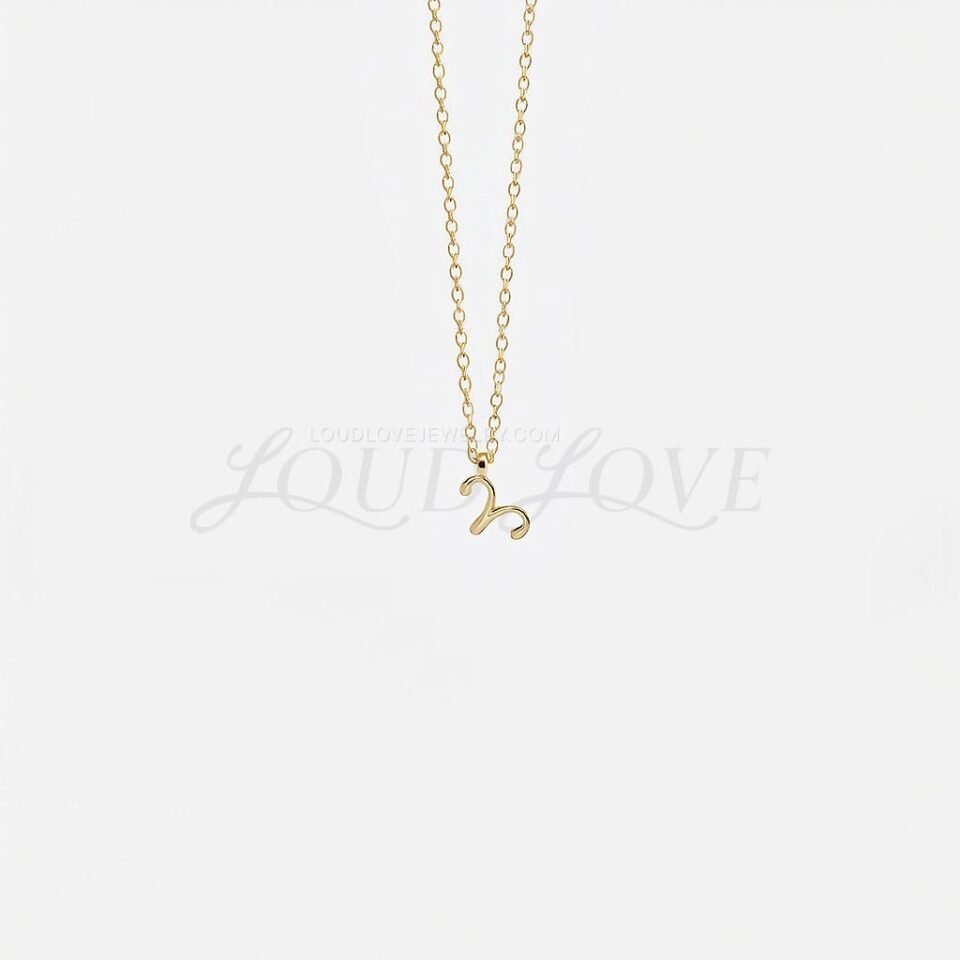 Gold Aries pendant necklace featuring the ram symbol, clean and minimal in design.