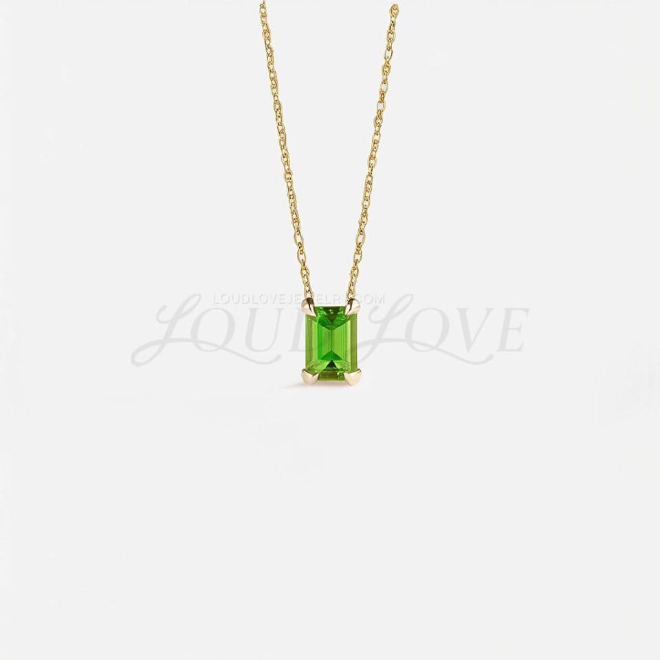 Emerald-cut natural peridot pendant on a fine chain, celebrating August's bright green gem.