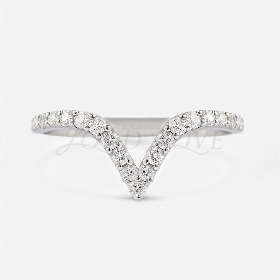 Chevron band with small pave-set diamonds designed for stacking or worn as a wedding band.
