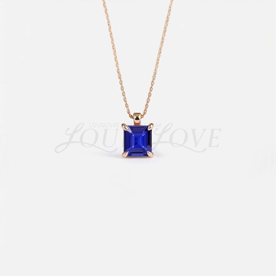 Princess-cut tanzanite pendant set in rose gold, representing December's modern birthstone.