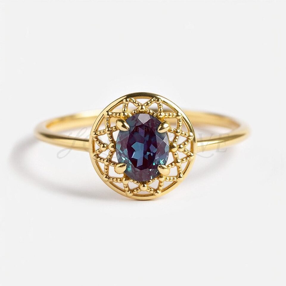 Oval lab alexandrite with lacy milgrain dreamcatcher design in yellow gold and 4-prong setting.