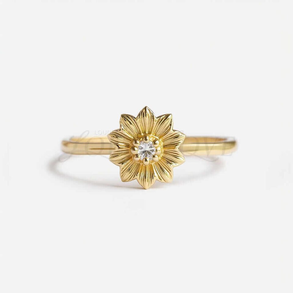 Delicate gold ring with petal-shaped flower and round moissanite at the center.