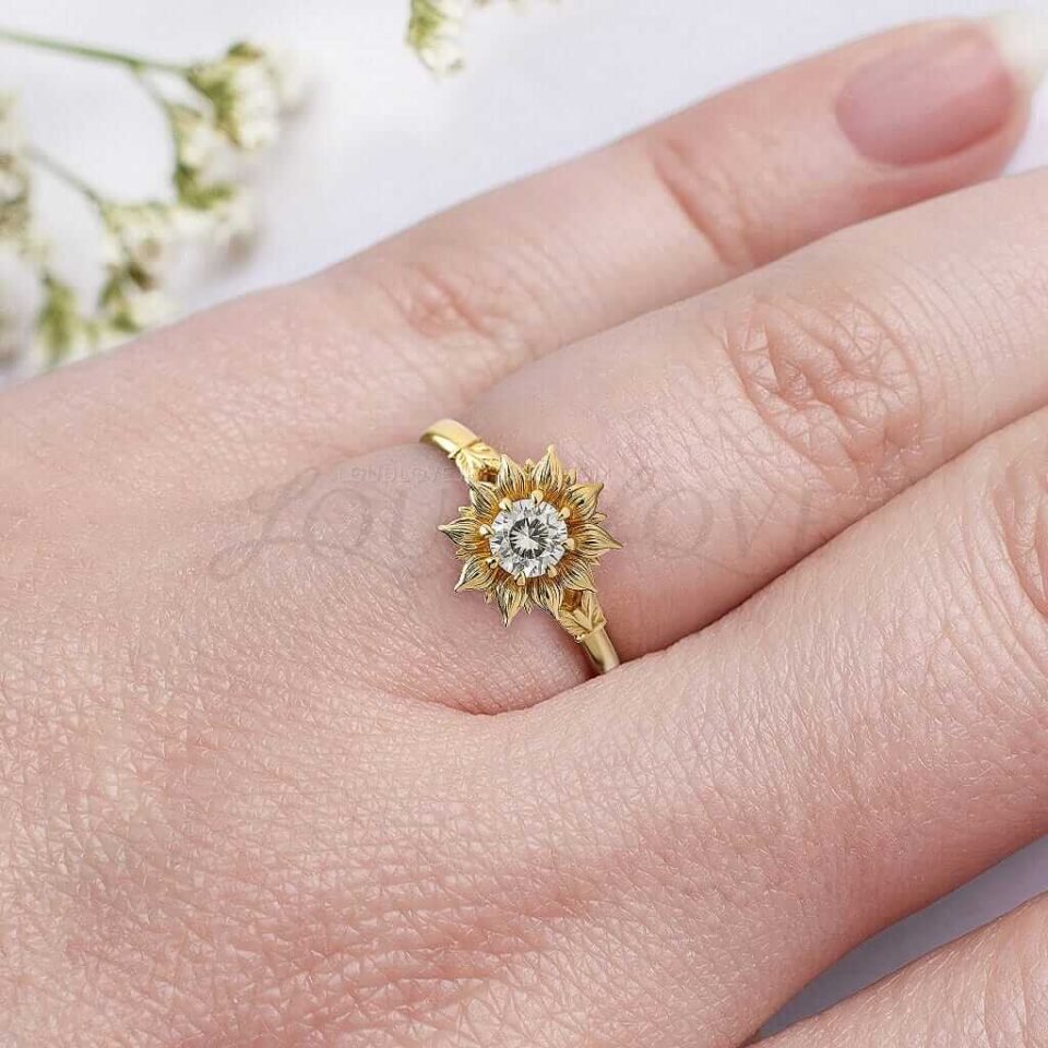 Yellow gold sunflower ring with round moissanite center and petal-inspired design.
