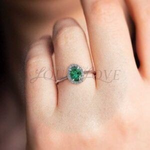 halo-lab-grown-emerald-engagement-ring-on-finger