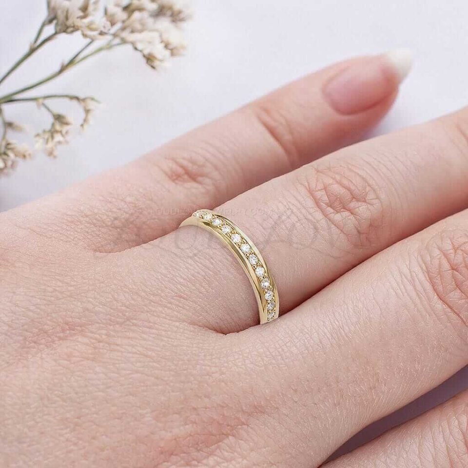 Eternity ring with channel-set round diamonds, offering a modern and secure setting.