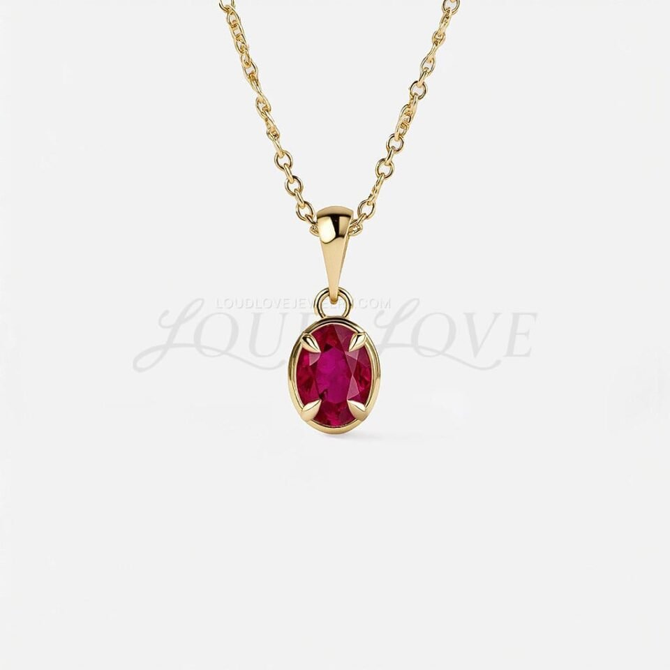 Oval lab-created ruby pendant in yellow gold, symbolizing July’s fiery birthstone.