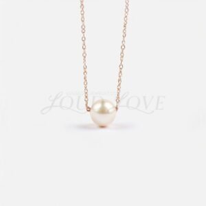 Drilled Akoya cultured pearl pendant on a rose gold chain, honoring June's classic birthstone.