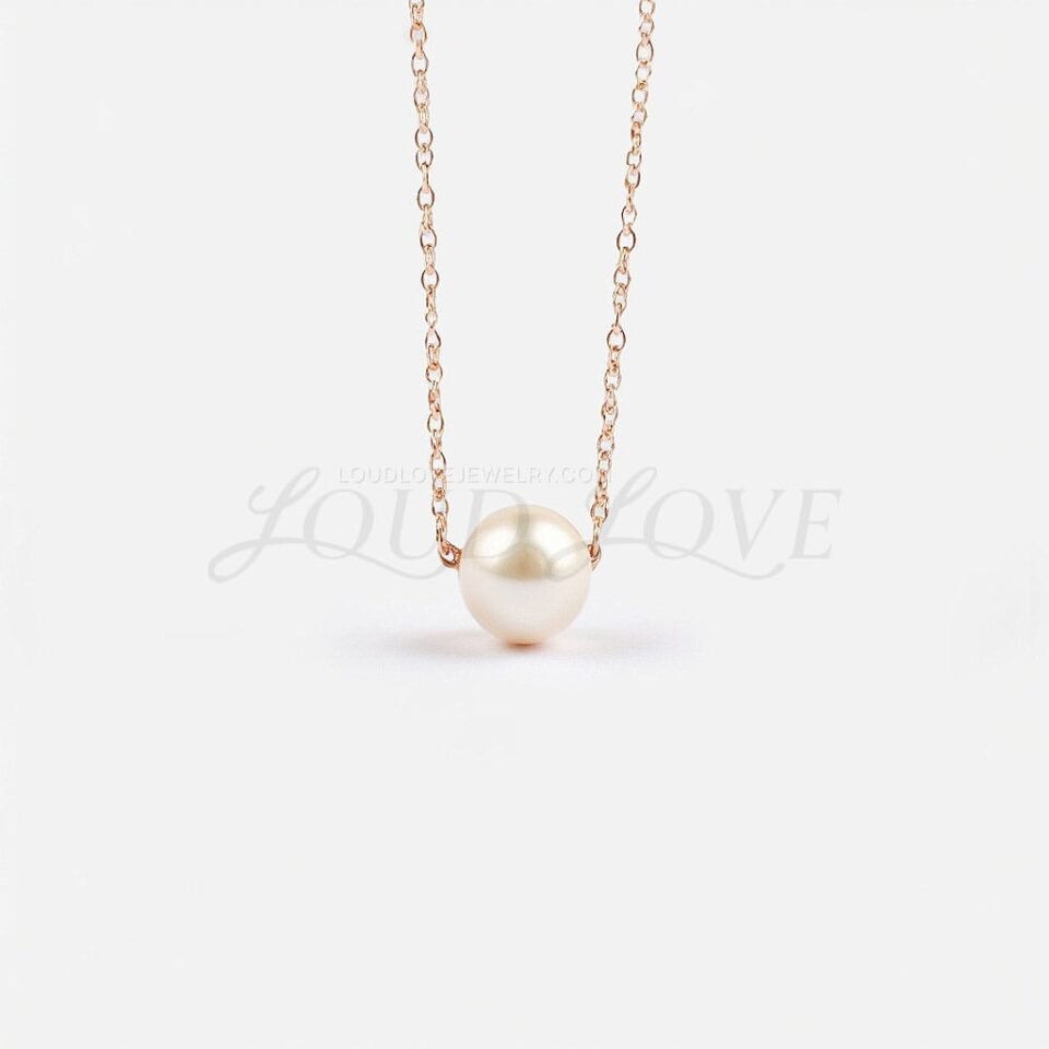 Drilled Akoya cultured pearl pendant on a rose gold chain, honoring June's classic birthstone.