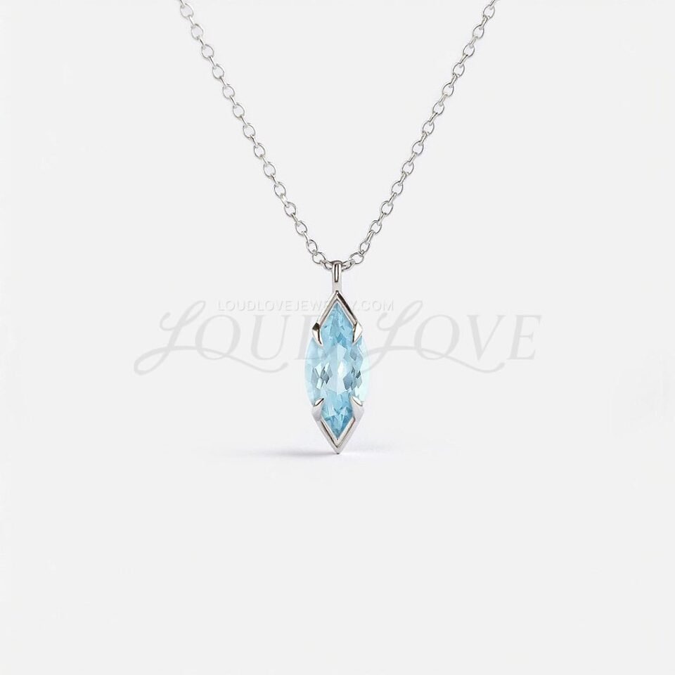 Marquise aquamarine pendant in a distinctive arrow-prong setting, celebrating March's birthstone.