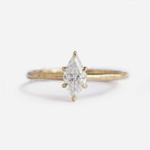 Marquise solitaire moissanite engagement ring with yellow gold setting and 6 prongs.