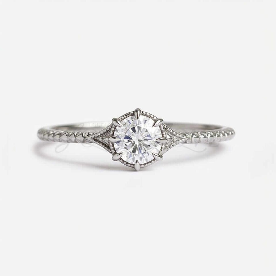 Round moissanite engagement ring with milgrain setting and scale-textured white gold band
