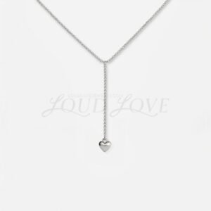 Delicate silver necklace with a slim drop ending in a tiny heart pendant, minimalist and sweet.