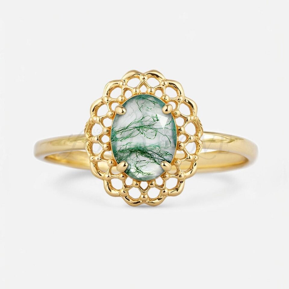 Oval moss agate ring with lace halo setting, front-facing.