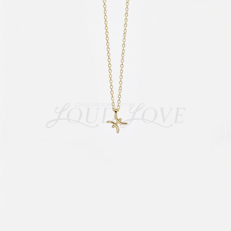 Pisces necklace featuring twin fish zodiac symbol in a graceful gold design.