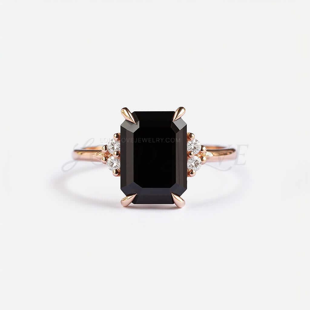 Emerald-cut black onyx framed by four white stones in a rose gold setting with bold contrast.