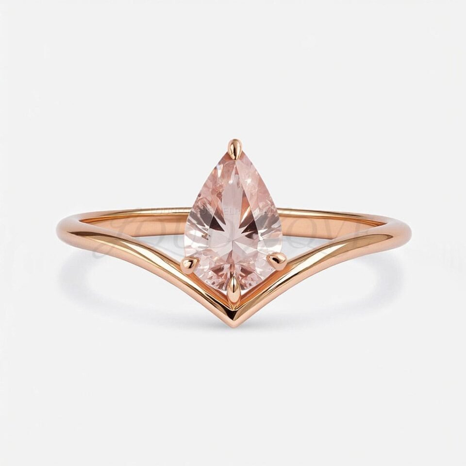 Front view of pear cut pink morganite set in a four-prong V-band crafted in rose gold.