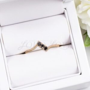 Modern 3-stone pave ring with diamonds set in a graceful bypass band