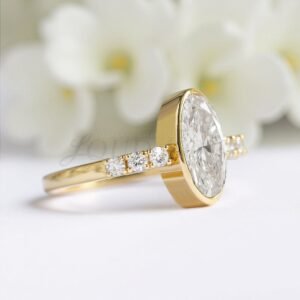 Side perspective of moissanite ring with elongated oval stone and side accents.