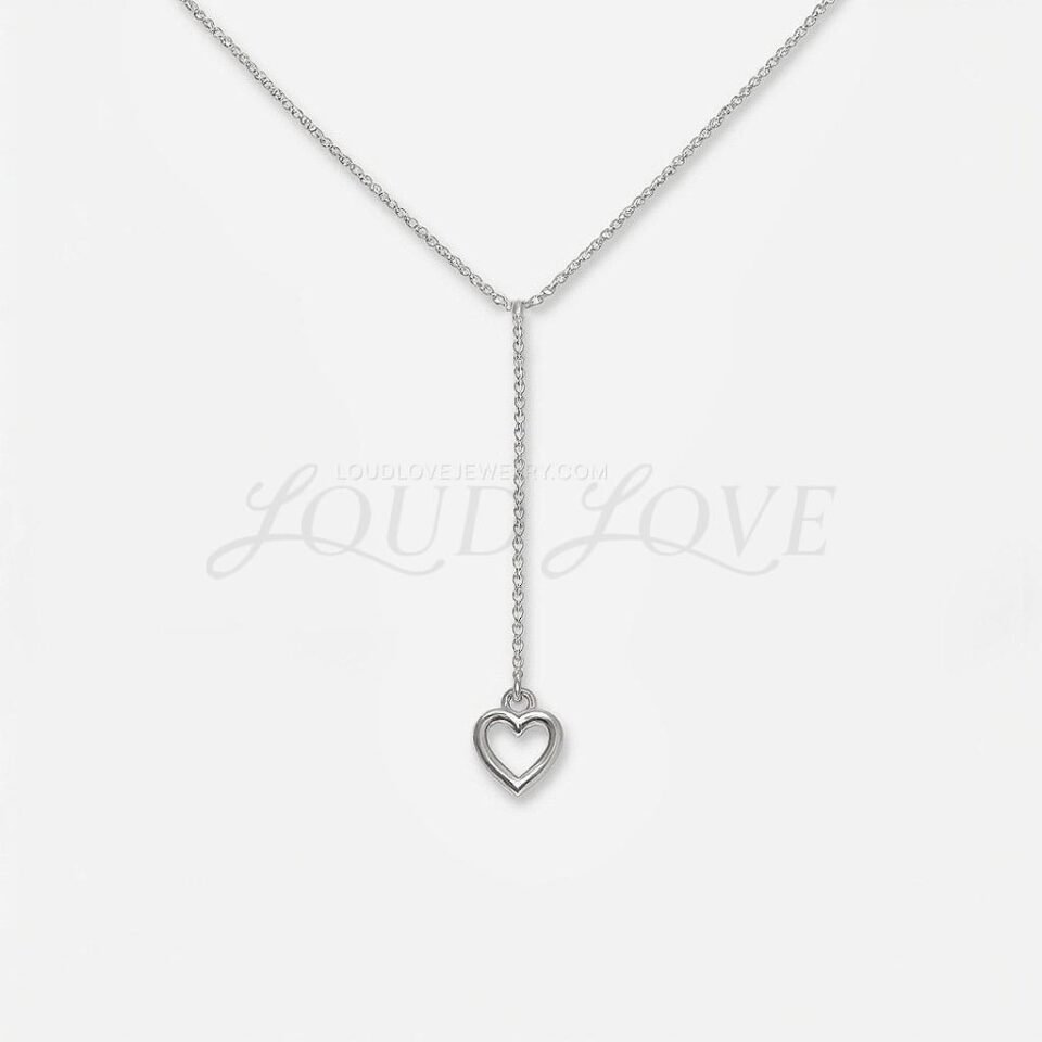 Polished silver heart pendant hanging from a short drop chain, simple and elegant in design.