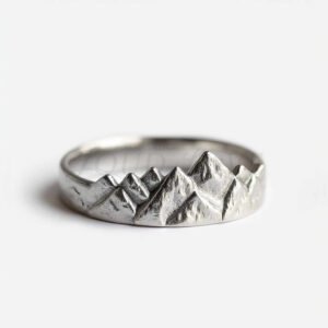 Mountain-shaped silver ring with rugged peaks.
