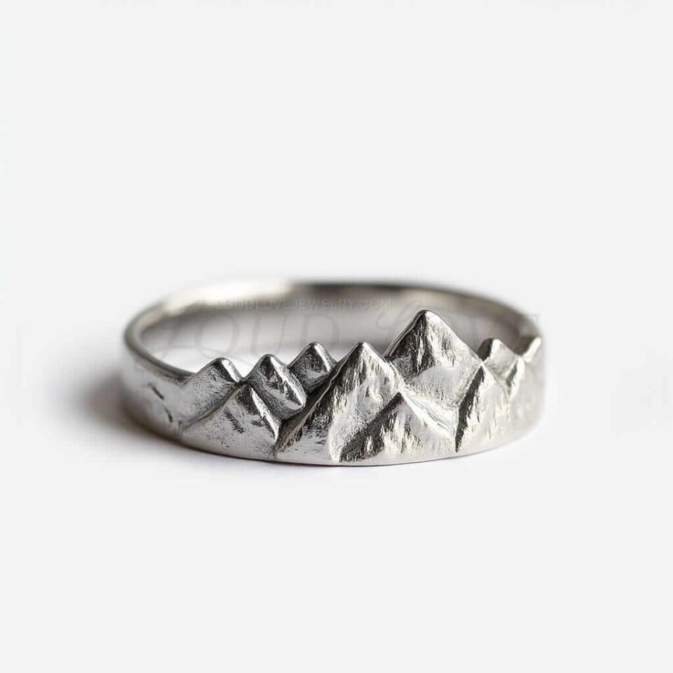Mountain-shaped silver ring with rugged peaks.