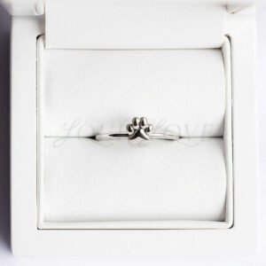 Paw print ring design displayed in a soft-lined presentation case.
