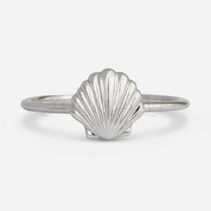 Silver shell ring with detailed ridged design.