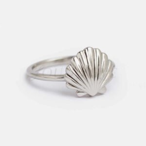 Seashell ring displayed in an elegant presentation setting.