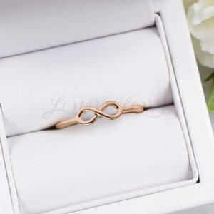 Jewelry box that stores the infinity ring set in rose 14k gold.