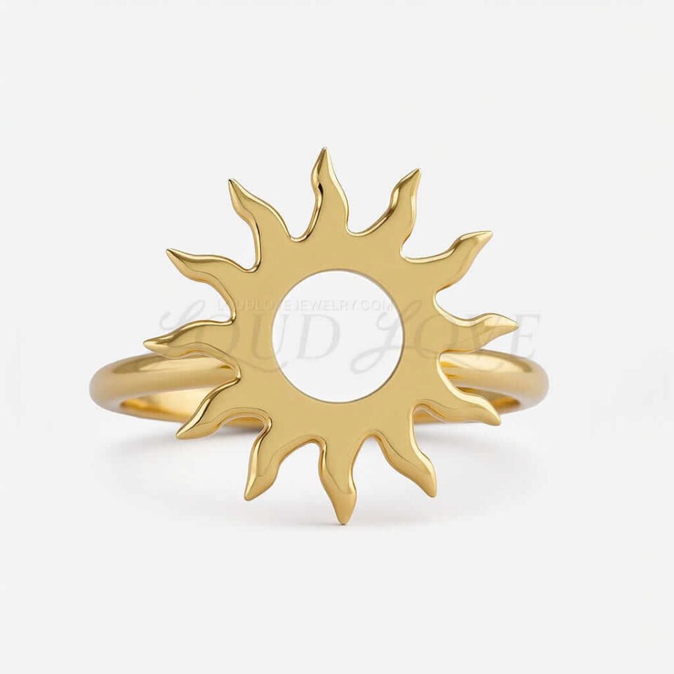Front of gold sun ring with pointed rays around a circular center.