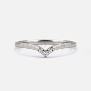 Shallow V-shaped gold stacking ring with three round stones in a symmetrical layout.