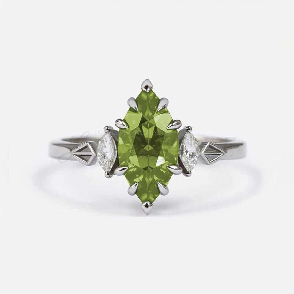 Three-stone engagement ring with marquise peridot center and white side stones.