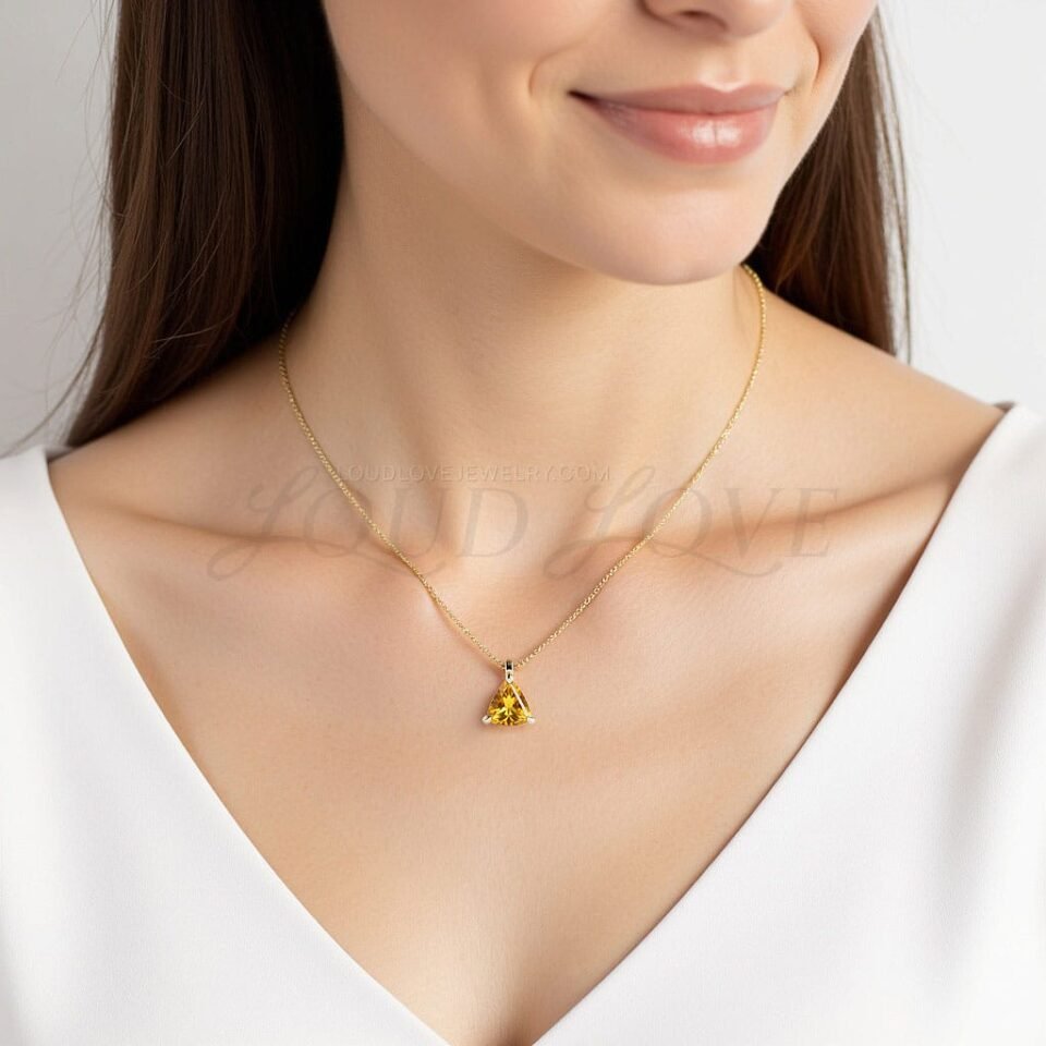 Modern yellow gold necklace with golden citrine, styled to catch attention with its bold shape.
