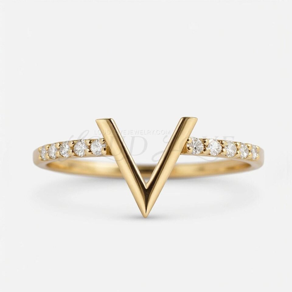 Elegant V band in gold with pavé diamonds, designed for stacking or solo wear.