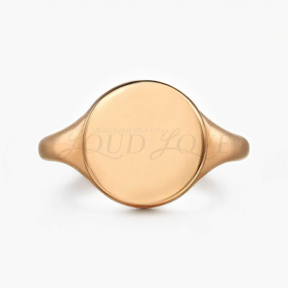 Plain rose gold ring on a white background.