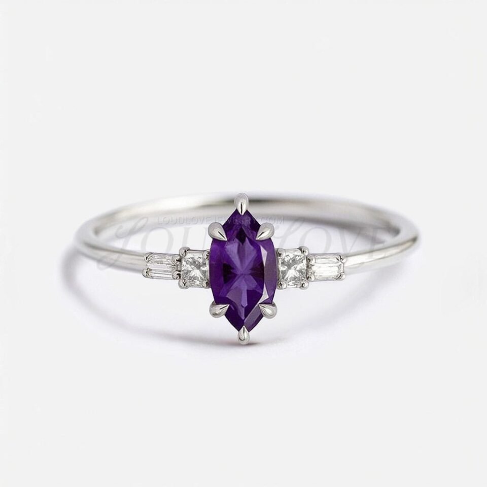 Marquise amethyst center with princess and baguette side stones in a white gold five-stone setting.