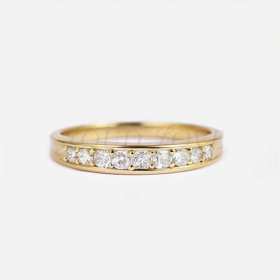 Modern looking etenity ring on white backdrop.
